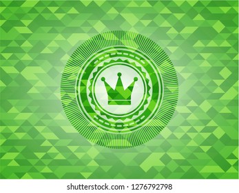 crown icon inside green mosaic emblem