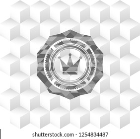 crown icon inside grey badge with geometric cube white background