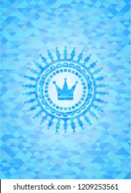 crown icon inside light blue mosaic emblem