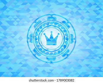 crown icon inside realistic sky blue emblem. Mosaic background. 