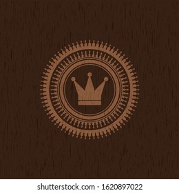 crown icon inside realistic wood emblem