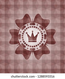 crown icon inside red seamless emblem or badge with abstract geometric pattern background.
