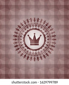 crown icon inside red seamless emblem with geometric pattern background.