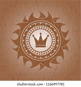 crown icon inside retro style wood emblem