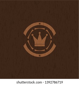 crown icon inside retro wooden emblem