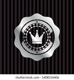 crown icon inside silver badge or emblem