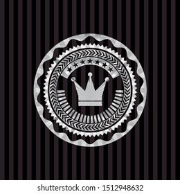 crown icon inside silver emblem