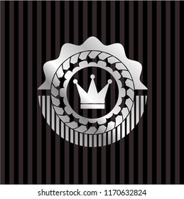 crown icon inside silvery badge or emblem