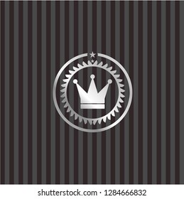 crown icon inside silvery badge or emblem