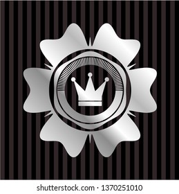 crown icon inside silvery badge
