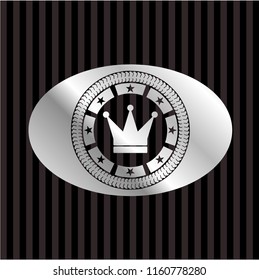 crown icon inside silvery emblem