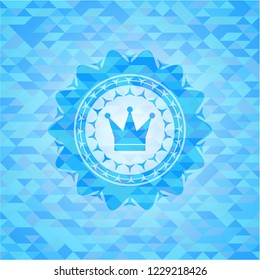 crown icon inside sky blue mosaic emblem