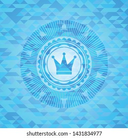 crown icon inside sky blue emblem with triangle mosaic background