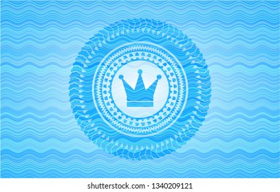 crown icon inside water concept badge background.