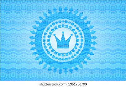 crown icon inside water wave representation badge background.