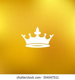Crown icon on a gold blurred background vector
