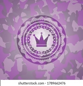 crown icon on pink and purple camouflaged pattern. 