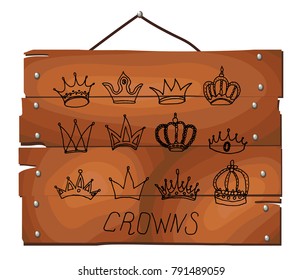 Crown icons on wooden plank background. Various crowns set. King icon set. Hand drawn vector illustration, doodle style.