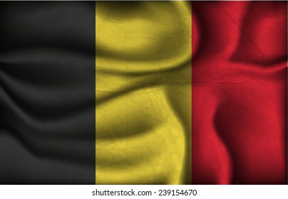 crumpled flag of Belgium on a light background.