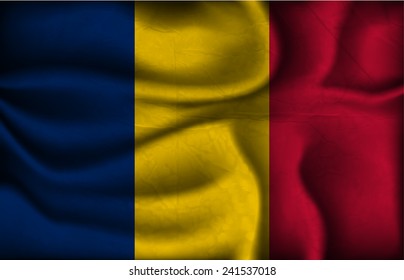 crumpled flag of Chad on a light background.