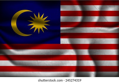 crumpled flag of Malaysia on a light background.