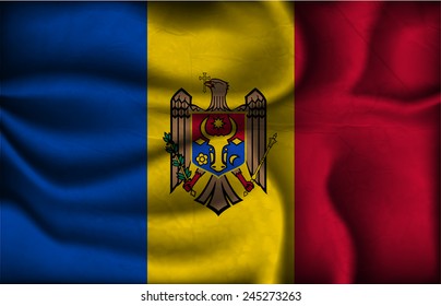 crumpled flag of Moldova on a light background.