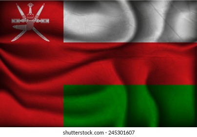 crumpled flag of Oman on a light background.