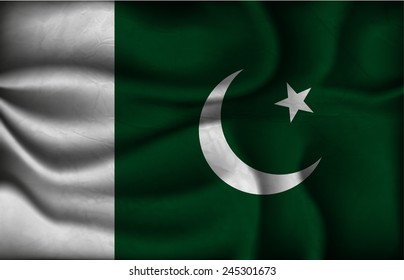 crumpled flag of Pakistan on a light background.