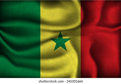 crumpled flag of Senegal on a light background.