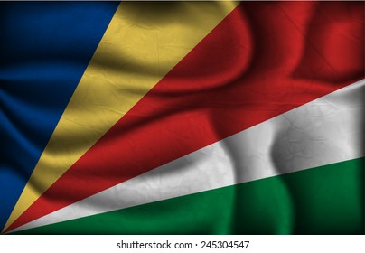 crumpled flag of Seychelles on a light background.