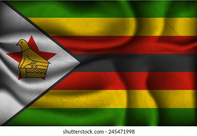 crumpled flag of Zimbabwe on a light background.