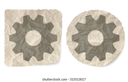 Crumpled slip of paper with cogwheels