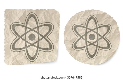 Crumpled slip of paper and a science symbol