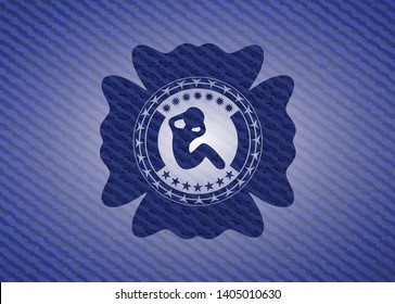 crunch icon inside badge with denim texture