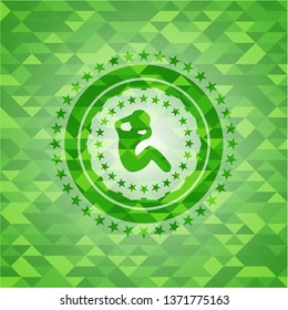 crunch icon inside green emblem with triangle mosaic background
