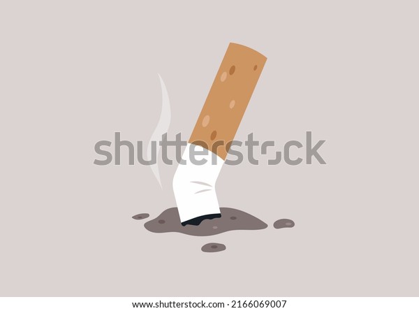 A crushed cigarette butt on the ground, unhealthy\
habits, a smoking concept