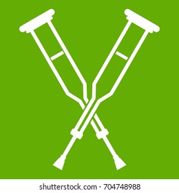 Crutches icon white isolated on green background. Vector illustration