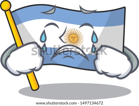 Crying argentina character flag folded above table