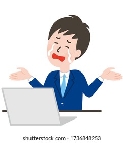 hombre asiático llorando operando una laptop