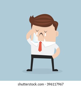 Crying businessman standing in a pool of his tears