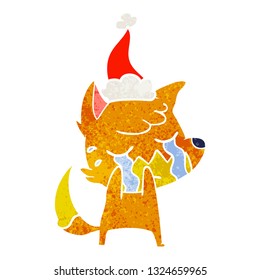 crying fox hand drawn retro cartoon of a wearing santa hat