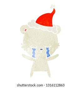 crying hand drawn retro cartoon of a polarbear wearing santa hat