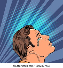 a crying man, human emotions. Sad mood, sadness