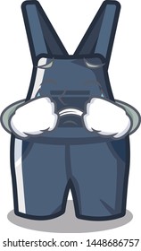 Crying overalls hanging on a cartoon wall