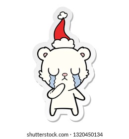 crying polar bear hand drawn sticker cartoon of a wearing santa hat