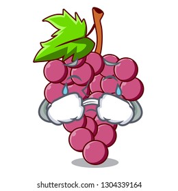 Crying red grapes fruit above mascot table