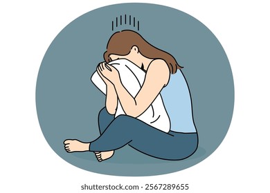 Crying woman sits hugging pillow and suffers because of problems in personal life or breaking up with boyfriend. Crying girl is experiencing psychological problems and needs help of psychotherapist