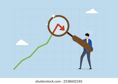 Cryptocurrency decline, Businessman analyst uses magnifying glass on pointing arrow down. 