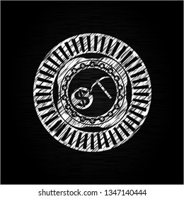 cryptocurrency mining icon inside chalk emblem written on a blackboard