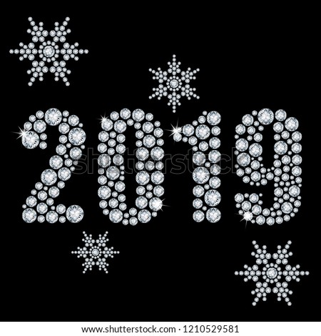 The crystals 2019 year from diamond on a black background and snowflakes